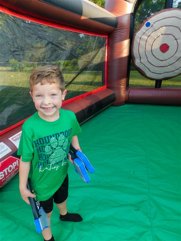 Students outside enjoying a family fun night for their school.